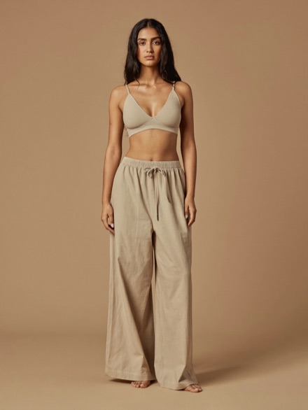 Elin Flare Trouser in Oat, worn with a bone bra top.