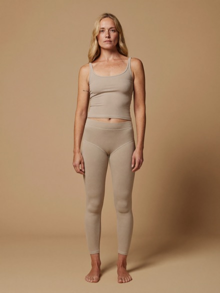 Elin Rib Tank in Oat, worn with matching leggings.