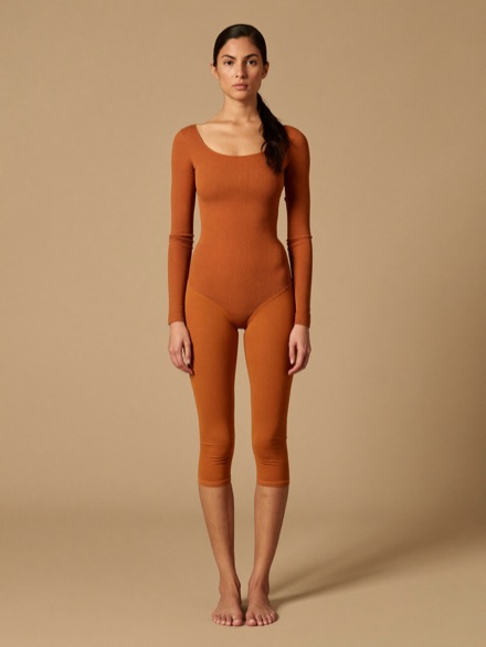 Lila Rib Bodysuit in Clay, worn with matching leggings.