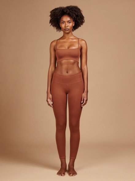 Sona Ribbed Bra in Clay, worn with matching leggings.